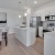 a kitchen with white cabinets