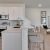 a kitchen with white cabinets