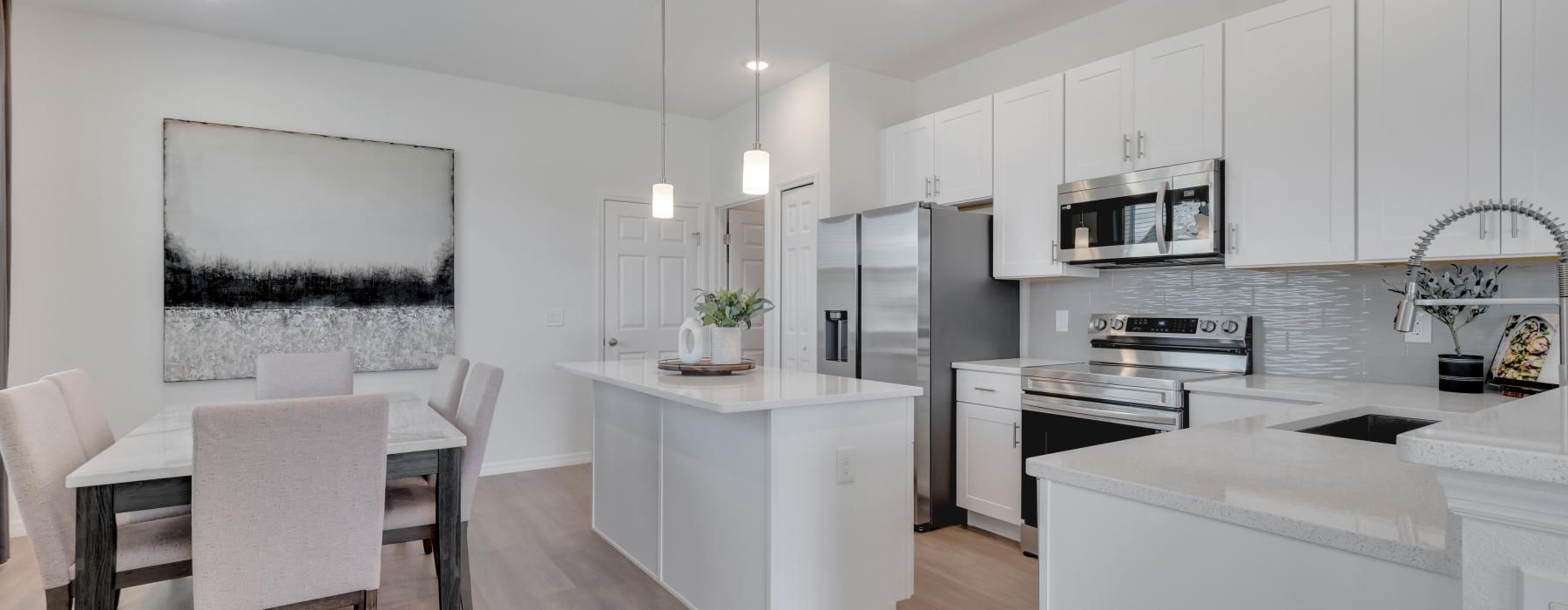 a kitchen with white cabinets